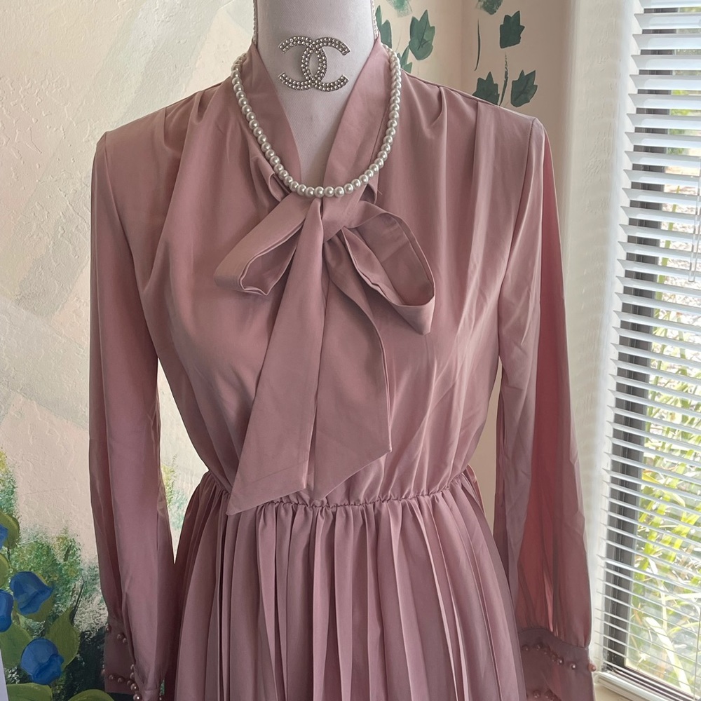 Vintage elegant light pink dress with pearls.